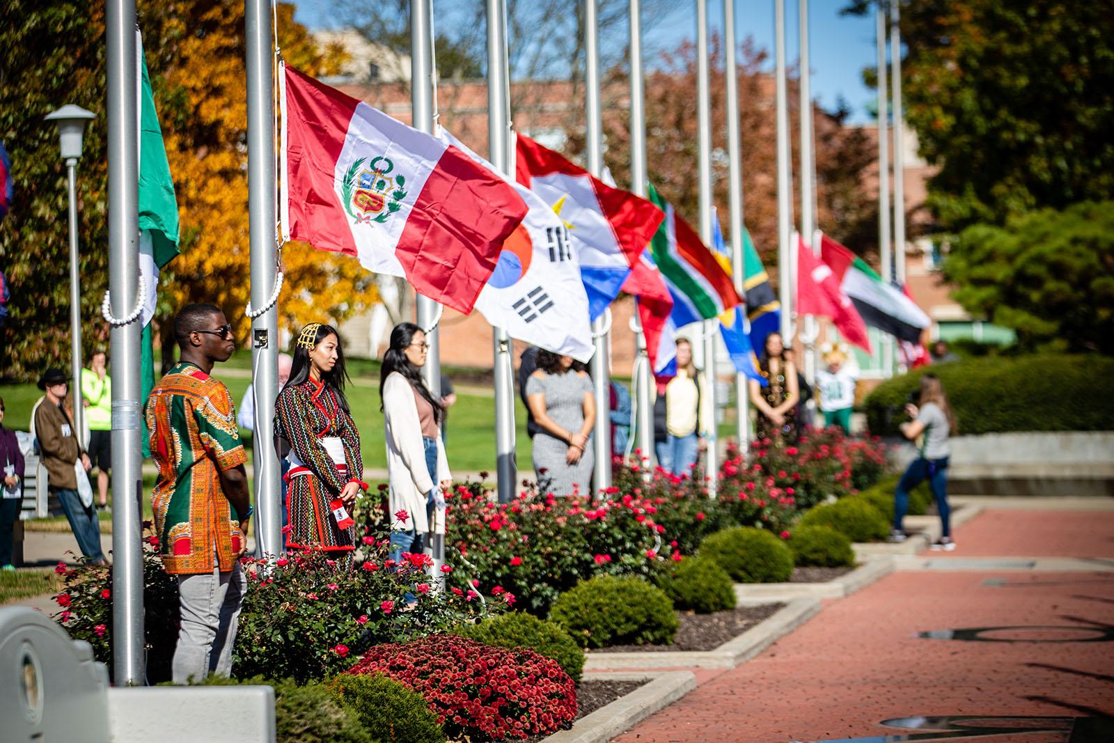 Northwest international students participate in a flag-raising ceremony during Homecoming activities each fall to celebrate their homelands and cultures as well the University’s diversity. 